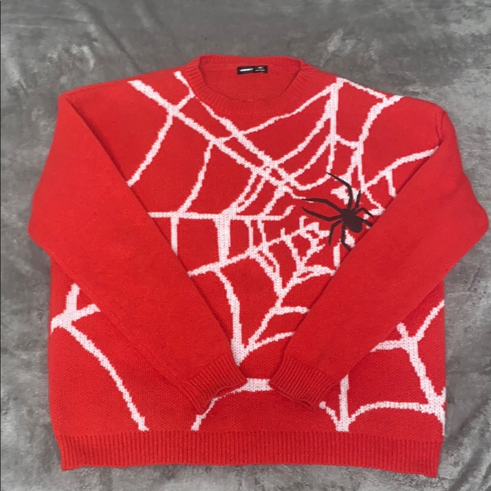 Red and White Crewneck Sweater with Bold Spider Web Design